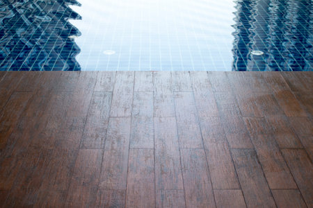 Tiles floor pattern over water pool.