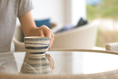 A Business woman is holding a white coffee cup.の写真素材