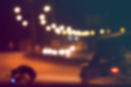 Blurred light on road in city with bokeh abstract background.の写真素材