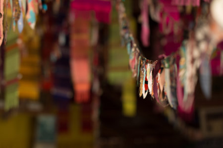 Blurred of festival flags in door on poor lighting at temple in Thailandの写真素材