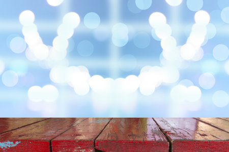 Wooden desk with blue gradient tone abstract background bokeh circles for Christmas background.
