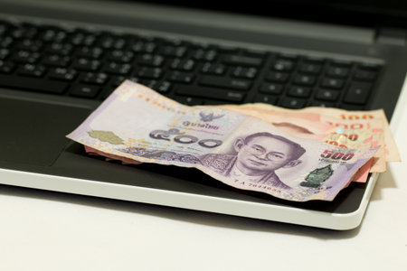 A blurred of  credit card and laptop after shopping on line, E-commerce net work marketing concept.