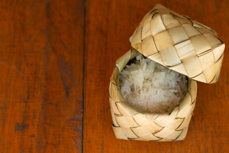 Sticky rice (Glutinous rice) in dry palm leaf container (kratip). Sticky rice is popular type of rice in Thailand with natural package.の写真素材