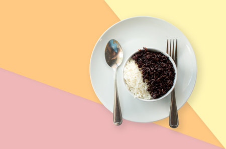 Rice in white plate on vintage pastel background.の写真素材