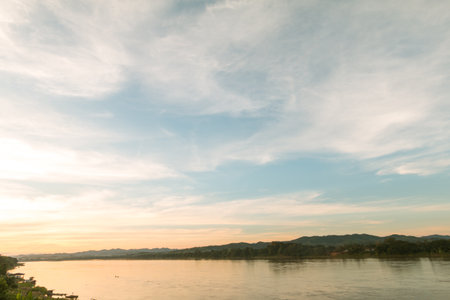 Clouds over river in sunrise time, Mae Khong river in Thailand.の写真素材