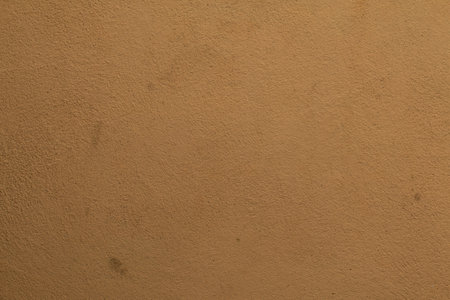 Cement wall paint orange color abstract background.の写真素材