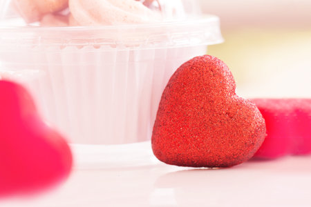 Valentines day concept, red decorate heart and dessert cup on sweet blurred background design for greeting card.の写真素材