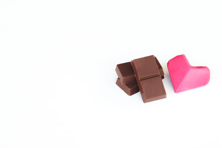 Chopped chocolate bars on white background.の写真素材