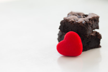 Valentines day concept, red decorate heart with Chocolate brownie on white  background design for greeting card.の写真素材