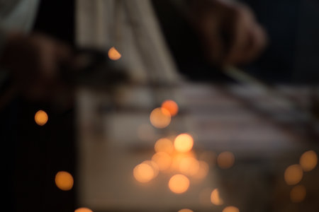Bokeh light from sparks, labour welding steel in the industry plants. image for background.