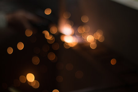 Bokeh light from sparks, labour welding steel in the industry plants. image for background.の写真素材