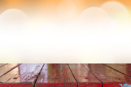 Empty desk with blurred light orange gradient bokeh abstract background.
