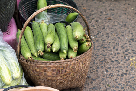 Sponge Gourd on bamboo basket at vintage Roi-Et market in Thailand.の写真素材