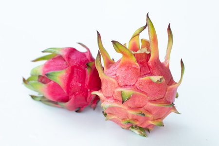 Fresh pitahaya fruit on white background or ripe dragon fruit red color with copy-space design for drinks package design, healthy article picture and plantation guide book design.の写真素材