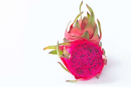 Fresh pitahaya fruit sliced on white background or ripe dragon fruit red color with copy-space design for drinks package design, healthy article picture and plantation guide book design.の写真素材