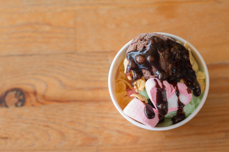 Homemade Organic Vanilla and Chocolate Ice Cream on wooden table.