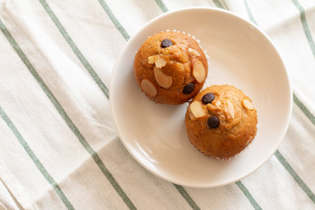 Homemade Banana cupcake with chocolate and cashew nut.の写真素材