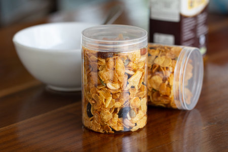 Homemade organic healthy granola with dried fruits in bottles.の写真素材