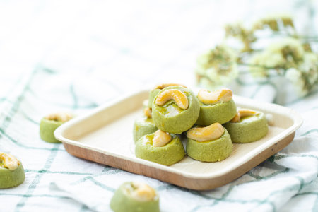 Matcha Green Tea Cookies Singapore or Matcha Green Tea cashew Cookies with dried flower blurred on...