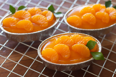 Homemade orange cake on wooden vintage table background.の写真素材