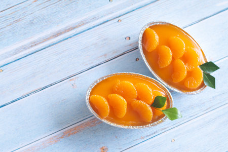 Homemade orange cake on wooden vintage table background.の写真素材
