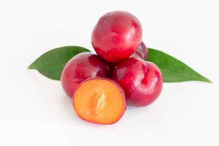 Isolated of Fresh red cherry plum on white background.の写真素材