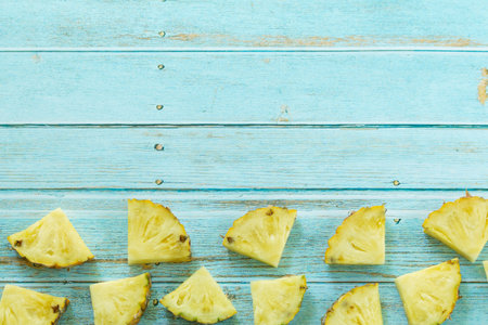 Ripe pineapples summer tropical fruits on pastel turquoise background. Summer fruit concept.の写真素材
