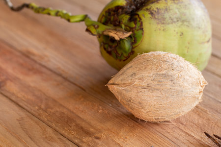 Dried coconut peel on wooden table background.
