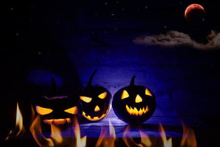 Halloween pumpkin head jack lantern in dark background.の写真素材