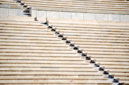 Rows of stone seats at stadiumの写真素材