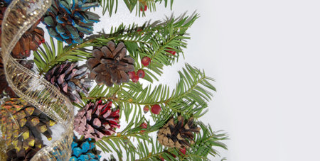 Christmas background. Composition of needles, dyed, golden decorative ribbon, tinsel.