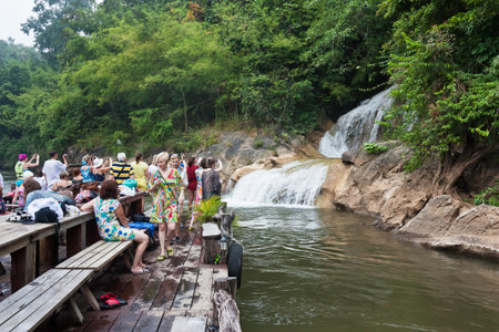 KANCHANABURI, THAILAND - NOVEMBER 11; Unidentified people tour at waterfall on November 11, 2012 in Triyok Yai National park, Khanchanaburi, Thailand  The beautiful National park western of Thailand  のeditorial素材