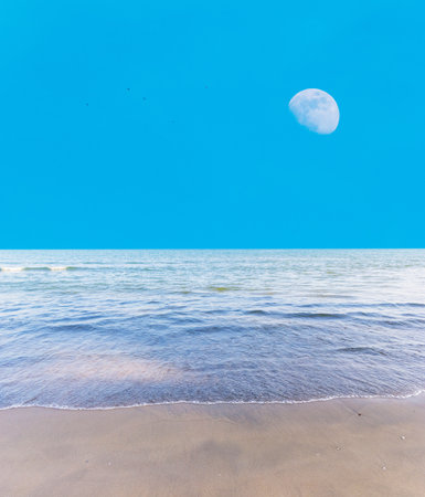 Blue sky with moon on daylightの写真素材