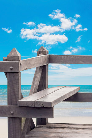 Wood chair at clean beach on summerの写真素材
