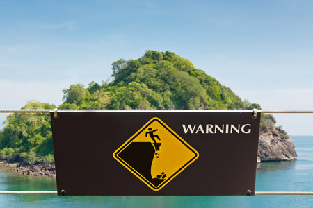 Warning sign at hill park in Thailandの写真素材