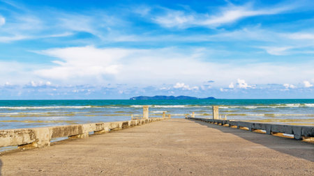 Jetty at beach with blue sky on daylightの写真素材