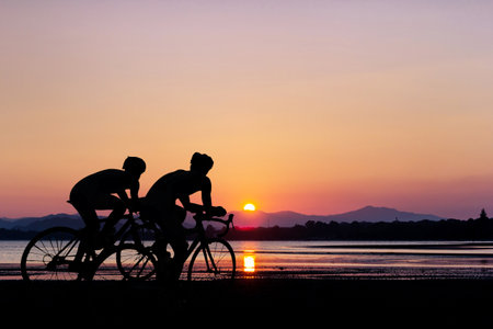 Triathlon sport at clean beach on twilight timeの写真素材