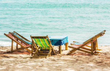 Chair and table at beach on daylight summer seasonの写真素材