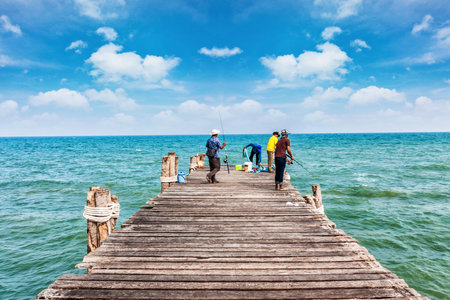 Fisherman at wooden jetty daylight time summer season in Thailand Asiaの写真素材