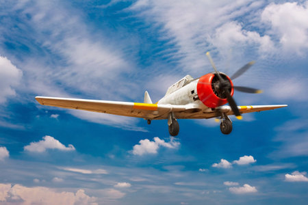 Vintage aircraft flying on daylight summer seasonの写真素材