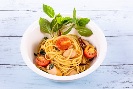 Spaghetti with sausage and chilli thai style foodの写真素材