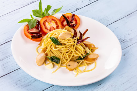 Spaghetti with sausage and chilly Thai style foodの写真素材