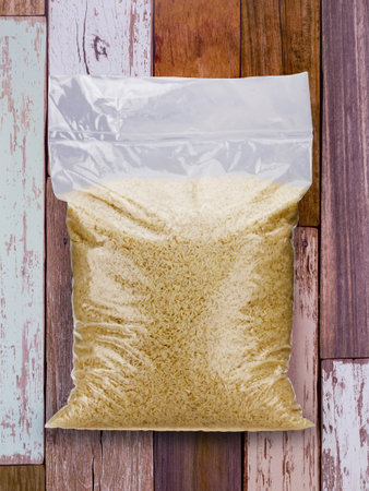 Jasmine rice bag on wooden boardの写真素材