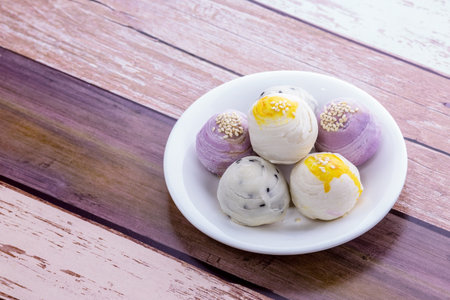 Chinese pastry on white plate wooden tableの写真素材