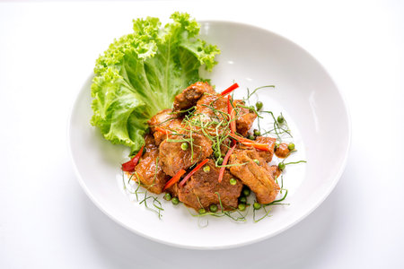 Stir fried pork spicy on whiteの写真素材