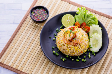 Fried rice with prawn on wooden tableの写真素材