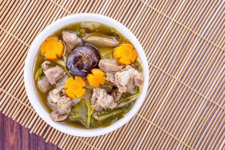 Mixture of vegetable soup on wooden tableの写真素材