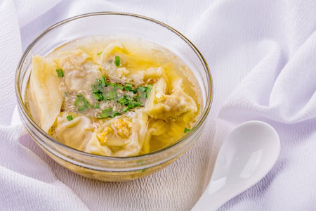 Dumpling pork soup on white backgroundの写真素材