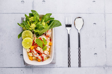 Steamed pork with lemon on wooden backgroundの写真素材