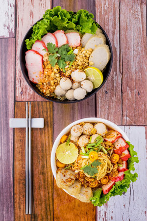 Tom yum noodles on wooden backgroundの写真素材